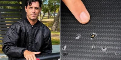 Dave Seymour montre les traces de dents d'un requin sur son e-foil endommagé